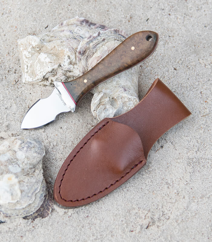 SK-47-Oyster-Knife-LS Ouster Knife on sand with Sheath