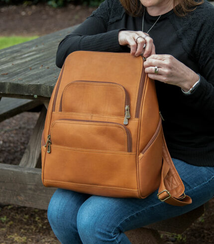 The Julia leather backpack will fit a 15” laptop.