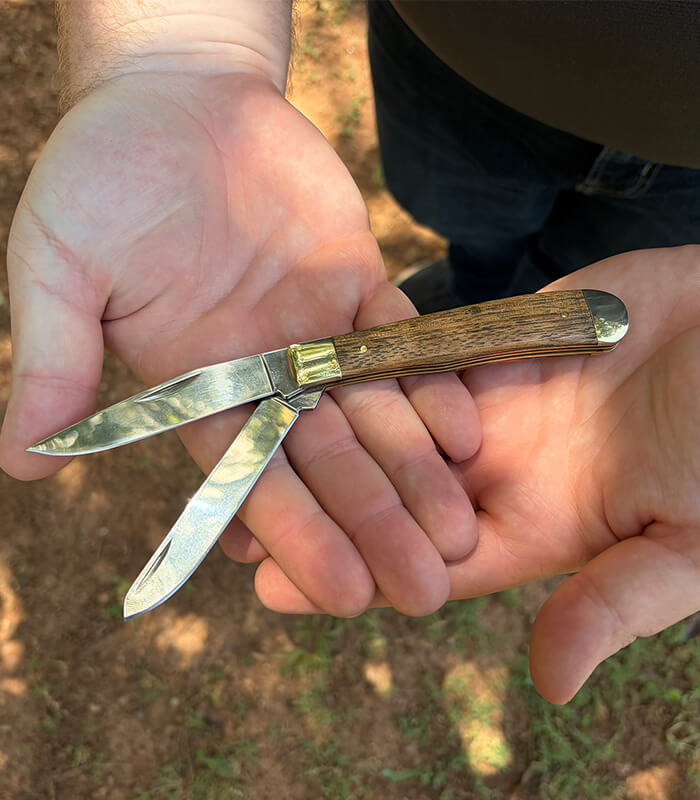 SK-228-sarge-knives-scout-large-zebrawood-2-blade-trapper-LS in Hands Both Blades_700x800px Sarge Knives Scout Large Zebrawood 2 Blade Trapper SK-228 featuring polished 440 stainless steel clip point and spey blades with zebrawood handles.