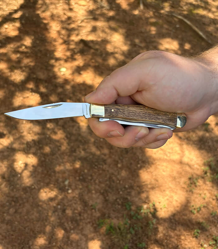 SK-228 -sarge-knives-scout-large-zebrawood-2-blade-trapper-in Hand 1 Blade_700x800px Sarge Knives Scout Large Zebrawood 2 Blade Trapper SK-228 featuring polished 440 stainless steel clip point and spey blades with zebrawood handles.